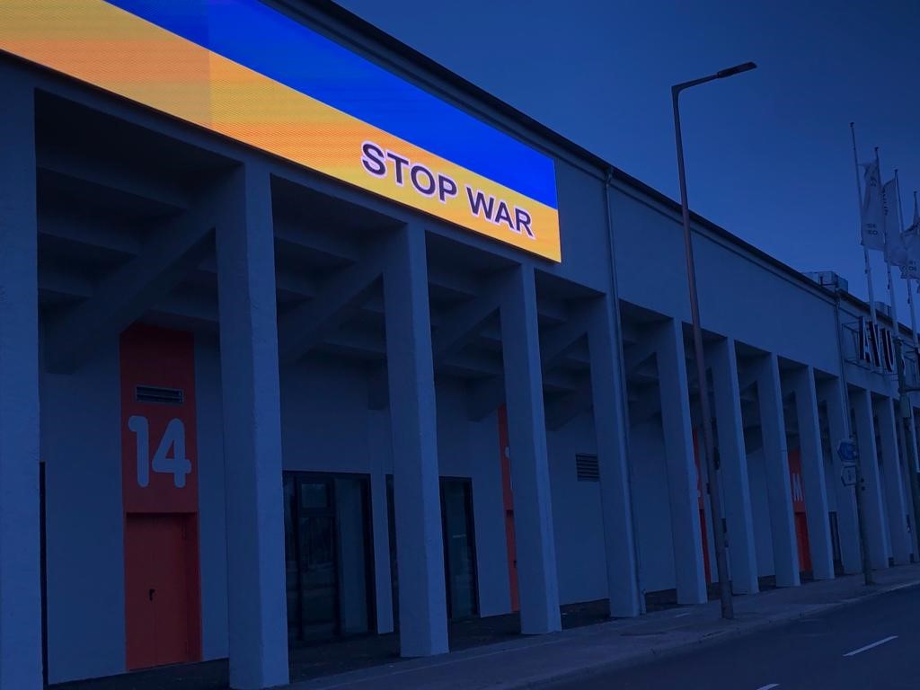Digital board with the text stop war